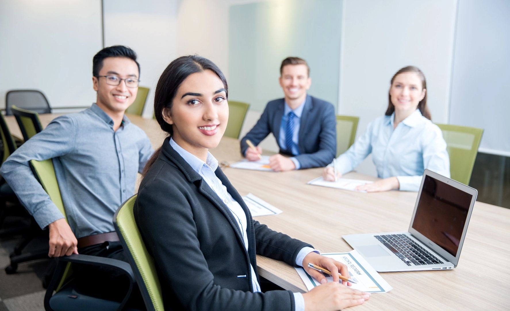 smiling-business-lady-working-with-colleagues@2x.jpg